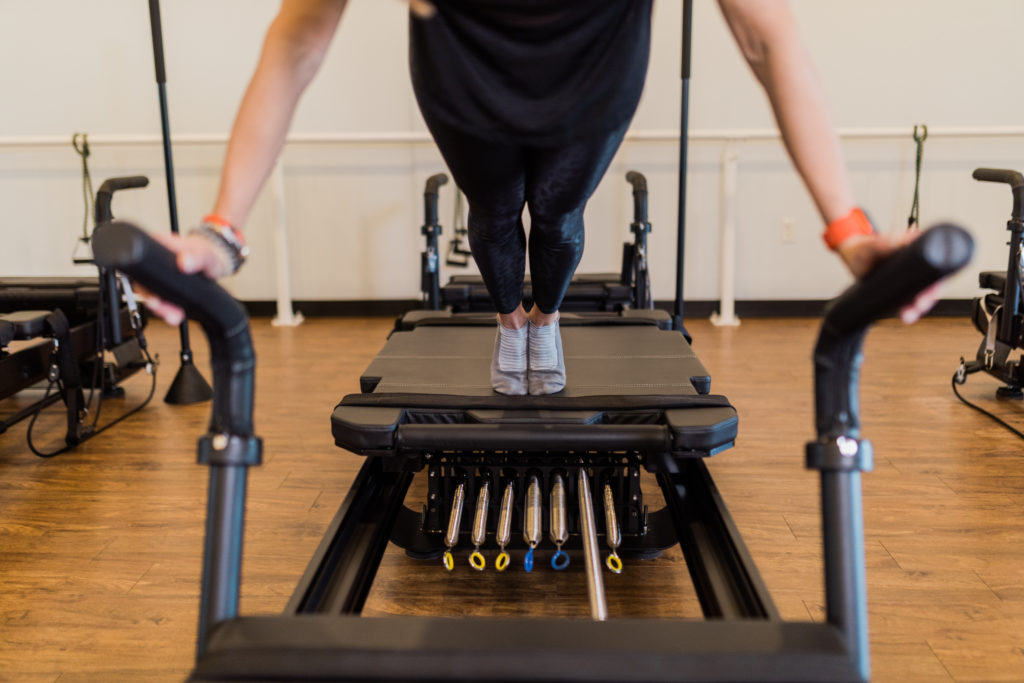 A Pilates machines in action at COREFIT Pilates & Barre.